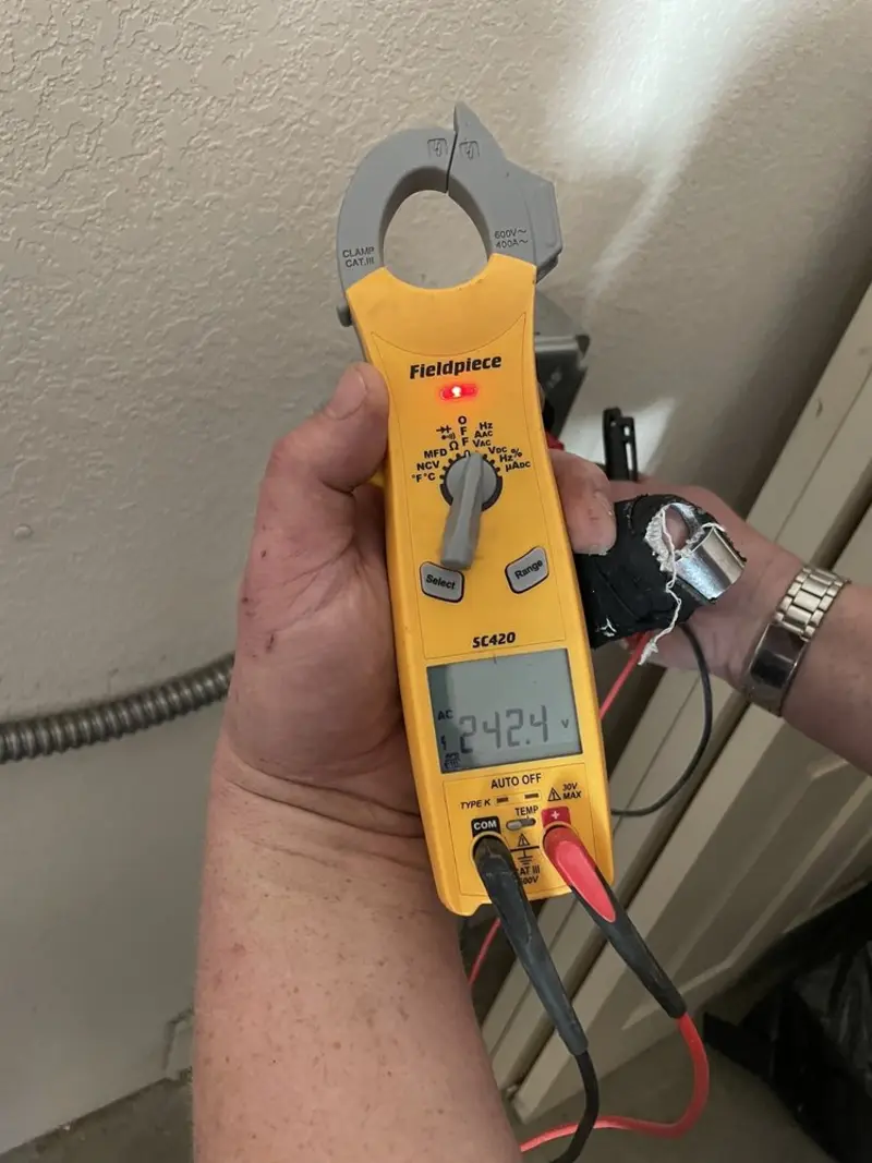 Voltage testing with clamp meter during Recessed Lighting Installation in Spindale